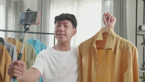 teenager vlogger reviews a light yellow linen shirt