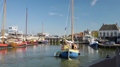 dutch harbour scene with boats and buildings