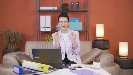 home office worker young woman getting good news from camera.