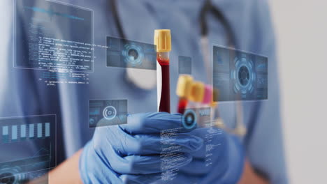 holding blood samples, medical professional with data analysis animation over