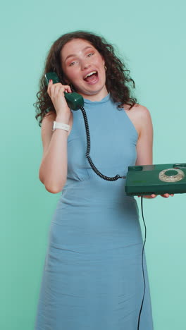 young woman talking on wired landline vintage telephone advertising proposition of conversation