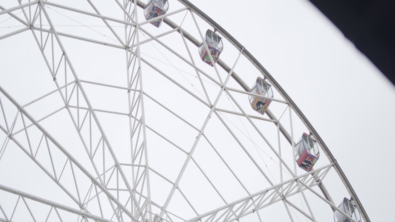 Ferris Wheel against a Cloudy Sky