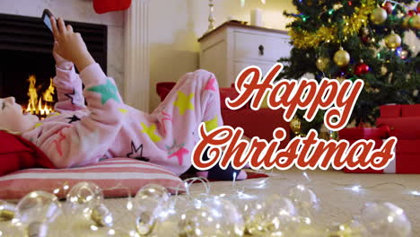 animation of season's greetings text over caucasian boy in christmas living room