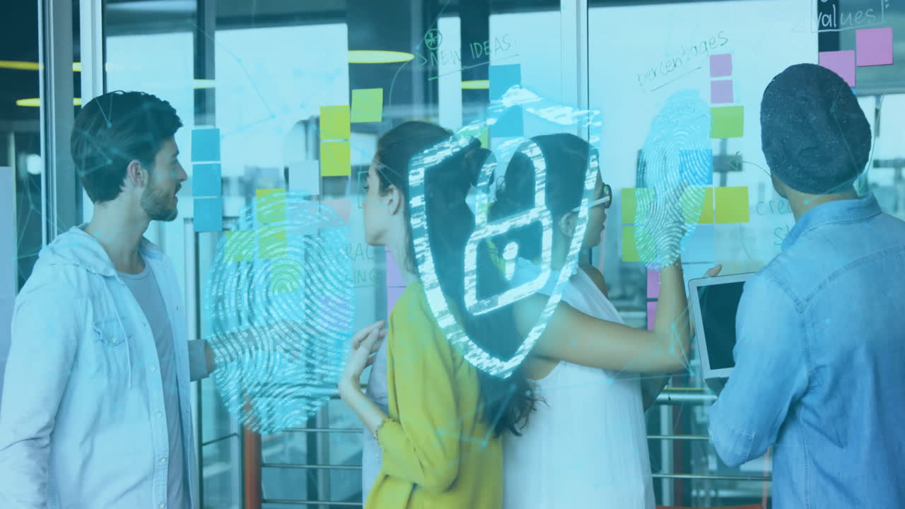 Diverse team collaborating with fingerprint and digital security animation overlay