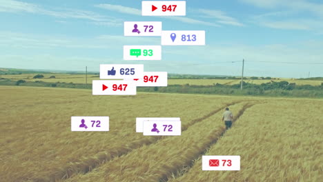 mature man walking through golden wheat field, displaying floating social media icons for marketing