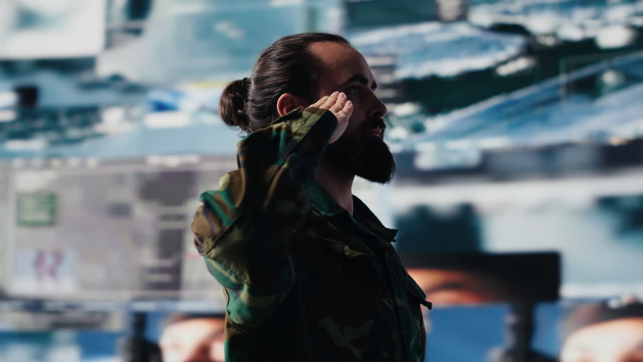 Veteran does military salute after reviewing satellite data in control center