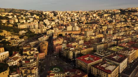 aerial tilt down shot showing historic old buildings in old town of naples city during golden hour - beautiful houses in italy in the evening - drone top down