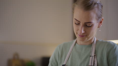 woman working in kitchen preparing bread dough