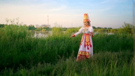 mari female folk dance outdoors at sunset