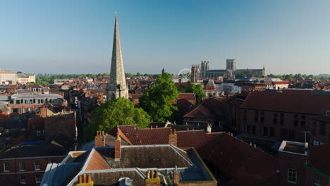 low establishing wide angle drone shot over medieval york city at sunrise uk