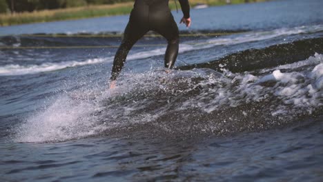 surfer surfing longboard in wave with cross step in slow motion