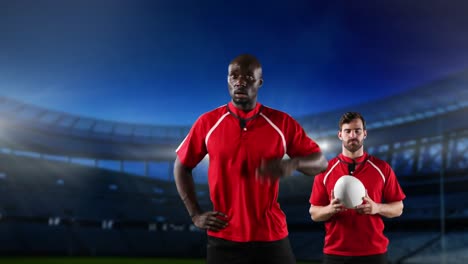 professional rugby players standing in front of a stadium