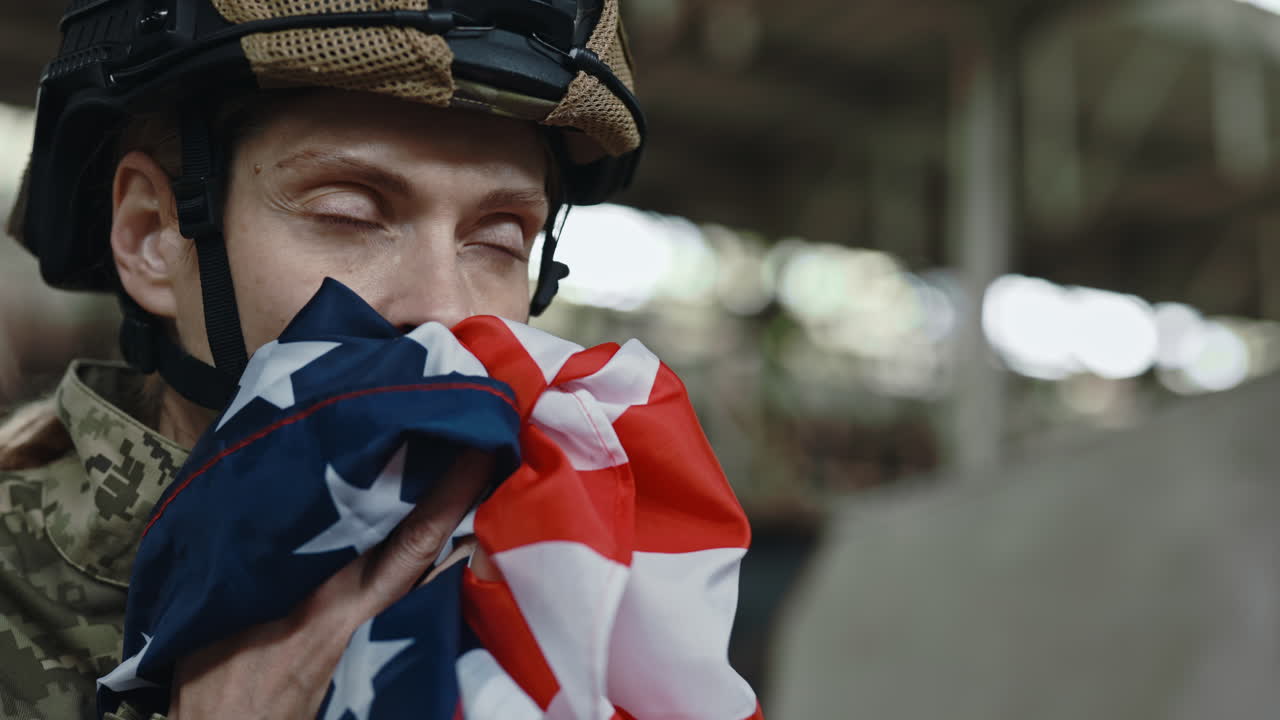 Military Woman Grieving Over American Flag