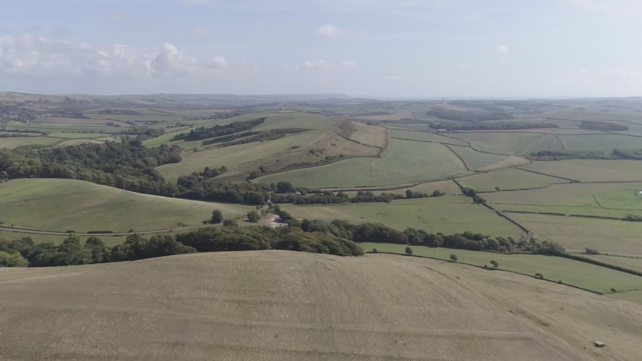 Scenic Landscape with Rolling Hills and Green Fields