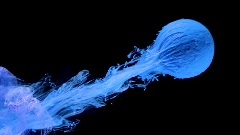multicolored ink paint slowly flows from the ball