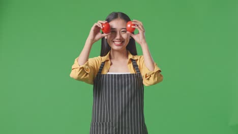 woman holding tomatoes