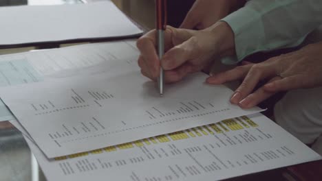 senior man signing documents