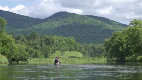 couple paddling down river in the white mountains of new hampshire