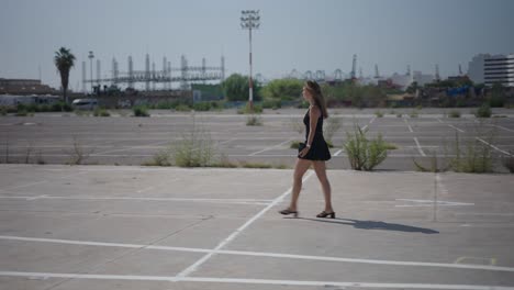 woman walking in urban parking lot