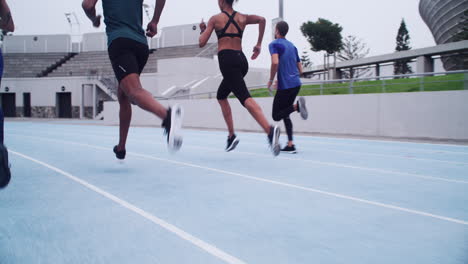 group of people running on a track