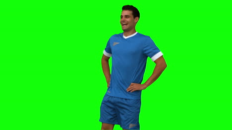 Football-player-warming-up-on-green-screen