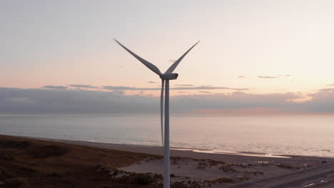 windturbines during sunset on the island neeltje jans, the netherlands