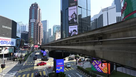 Iconic-and-busy-Bukit-Bintang-district-of-Kuala-Lumpur-with-its-monorail-train-station,-Malaysia