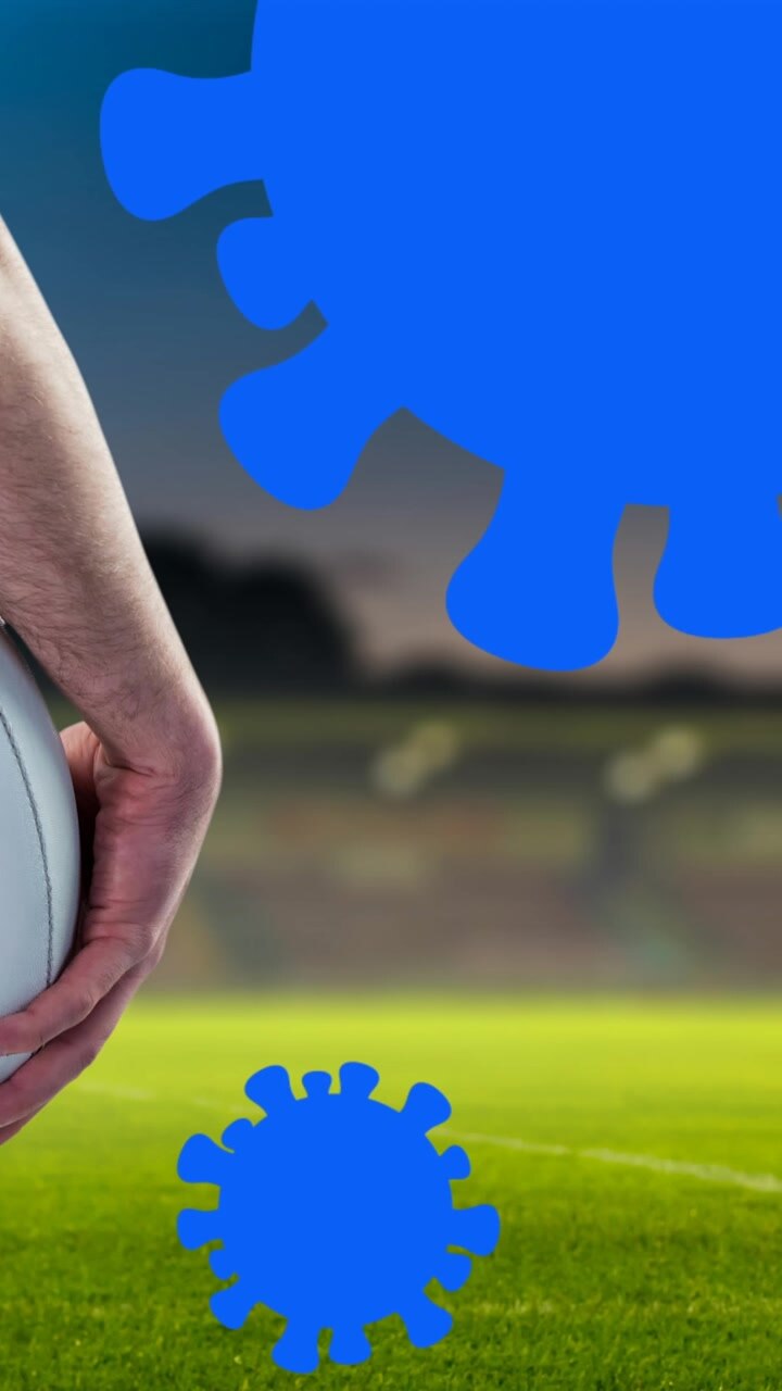 Animazione di cellule Covid-19 che cadono su un giocatore di football americano.