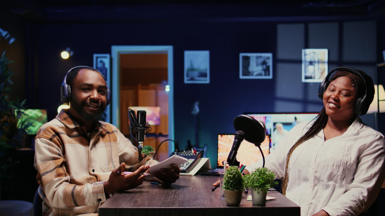 Man filming online podcast episode with woman, discussing about personal life