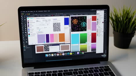 laptop with graphic design software open
