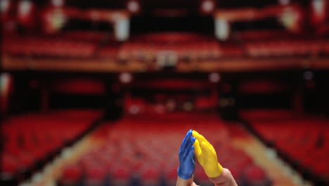 tiny finger hands applauding in theater setting