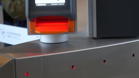 passenger scanning boarding pass at airport security gate