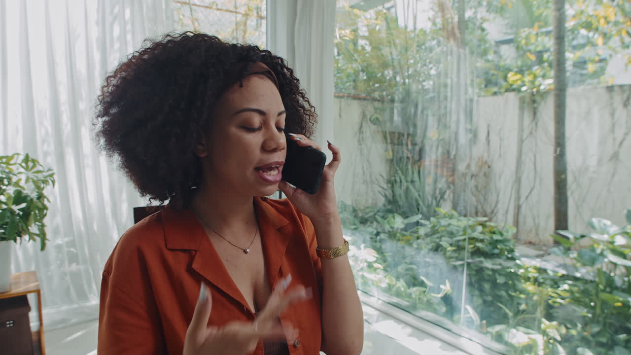 Freelance Worker Talking with Colleagues on Mobile Phone and Drinking Tea