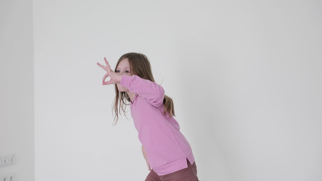A young girl in a pink shirt