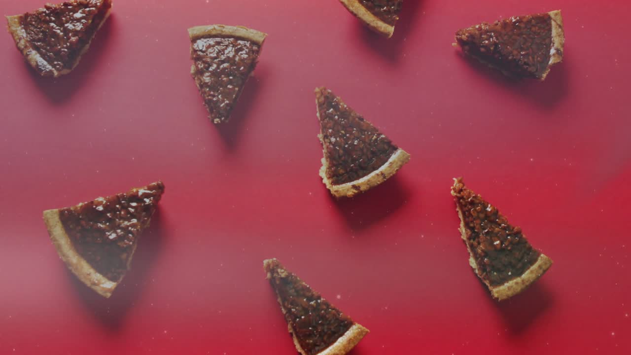 At start overhead camera shifting focus while sweeping light leak across tart slices showing grid