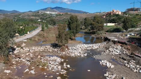 Reconstruction of a river breakwater after flooding in Southern Europe