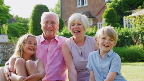 grandparents and pre-teen grandkids together in the garden