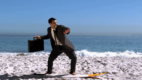 smiling businessman balancing on a surfboard