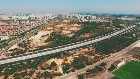 Aerial-of-a-freeway-with-city-background