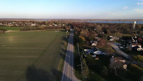 aerial footage of a street in a small town during a sunny afternon in illinois