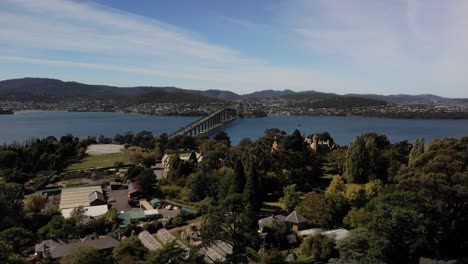 Hobart-Tasmania-Bay-Bridge-drone-panoramic-view-of-nature,-water-and-trees-in-4k-daylight