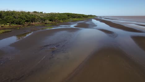 Rising-forward-aerial-of-sand-banks-and-woodlands-by-Rio-de-la-Plata