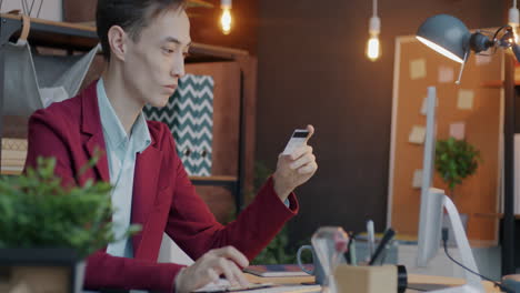 person working on a desk with a credit card