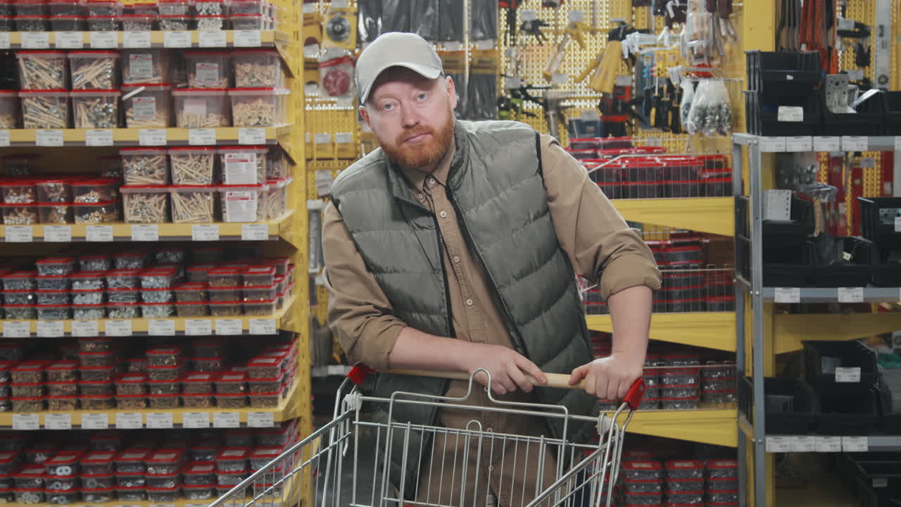 Man Shopping and Posing for Camera at Hardware Store