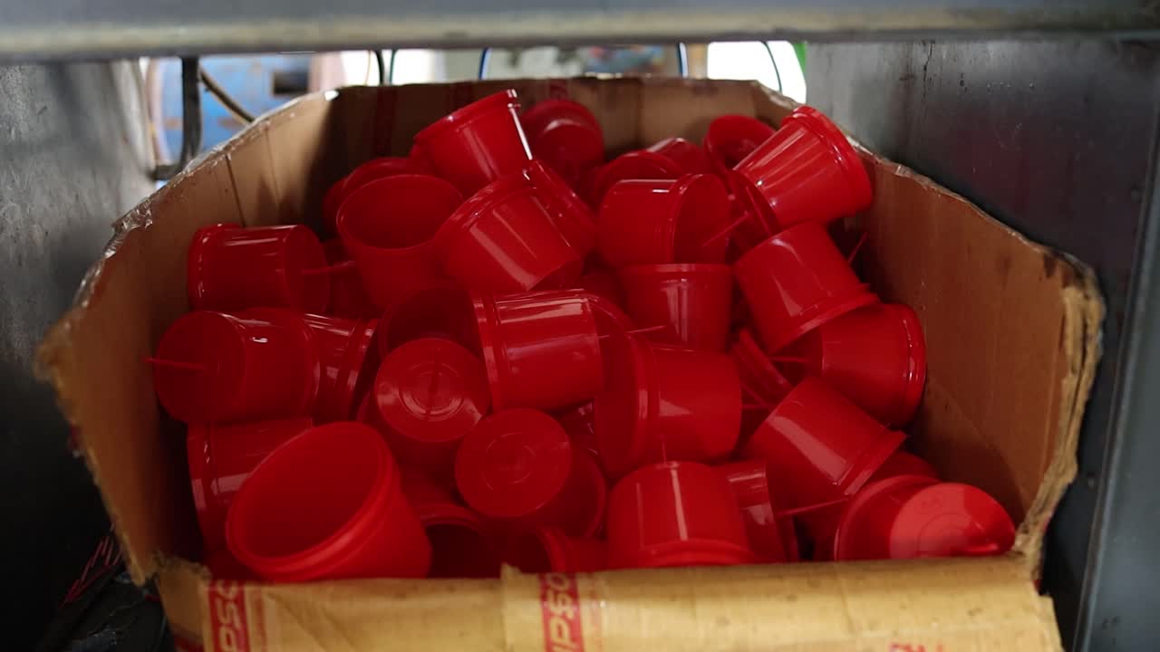 Red Plastic Cups in a Cardboard Box