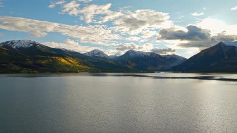 aerial view of snow-capped peaks in the distance, with rocky terrain below in independence pass