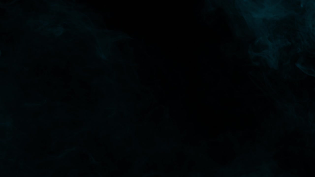 Cyan arctic fog rolling slowly on black background seamless loop