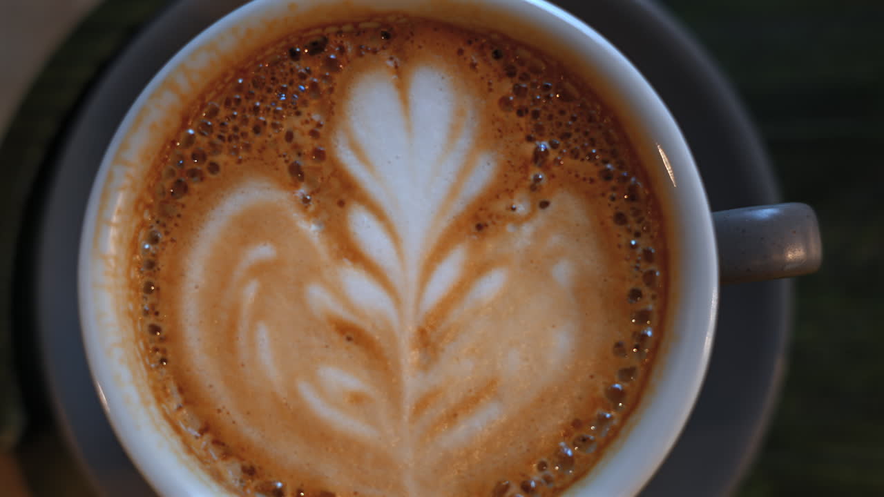 Top down shot of foam latte art on coffee