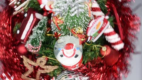 top view of christmas decorations rotating on a small table