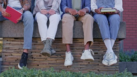 group of students sitting together on campus